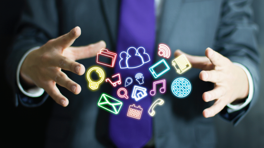 Businessman managing digital icons for communication, marketing, and technology solutions with holographic interface