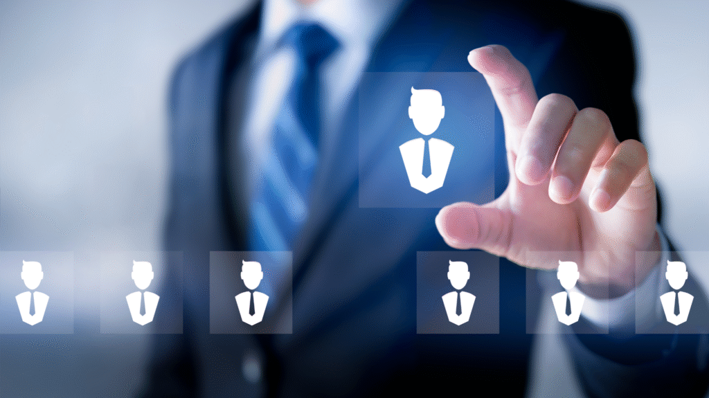 Businessman in a suit selecting a candidate icon on a virtual screen, symbolizing AI-powered recruitment and talent acquisition.
